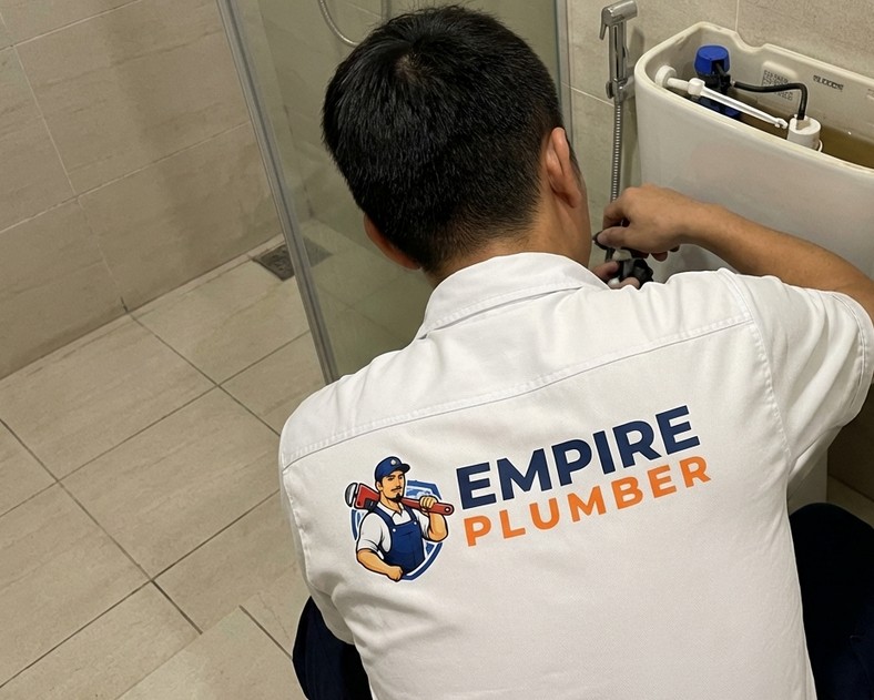 Empire Plumber technician working on toilet cistern repair in Kuala Lumpur